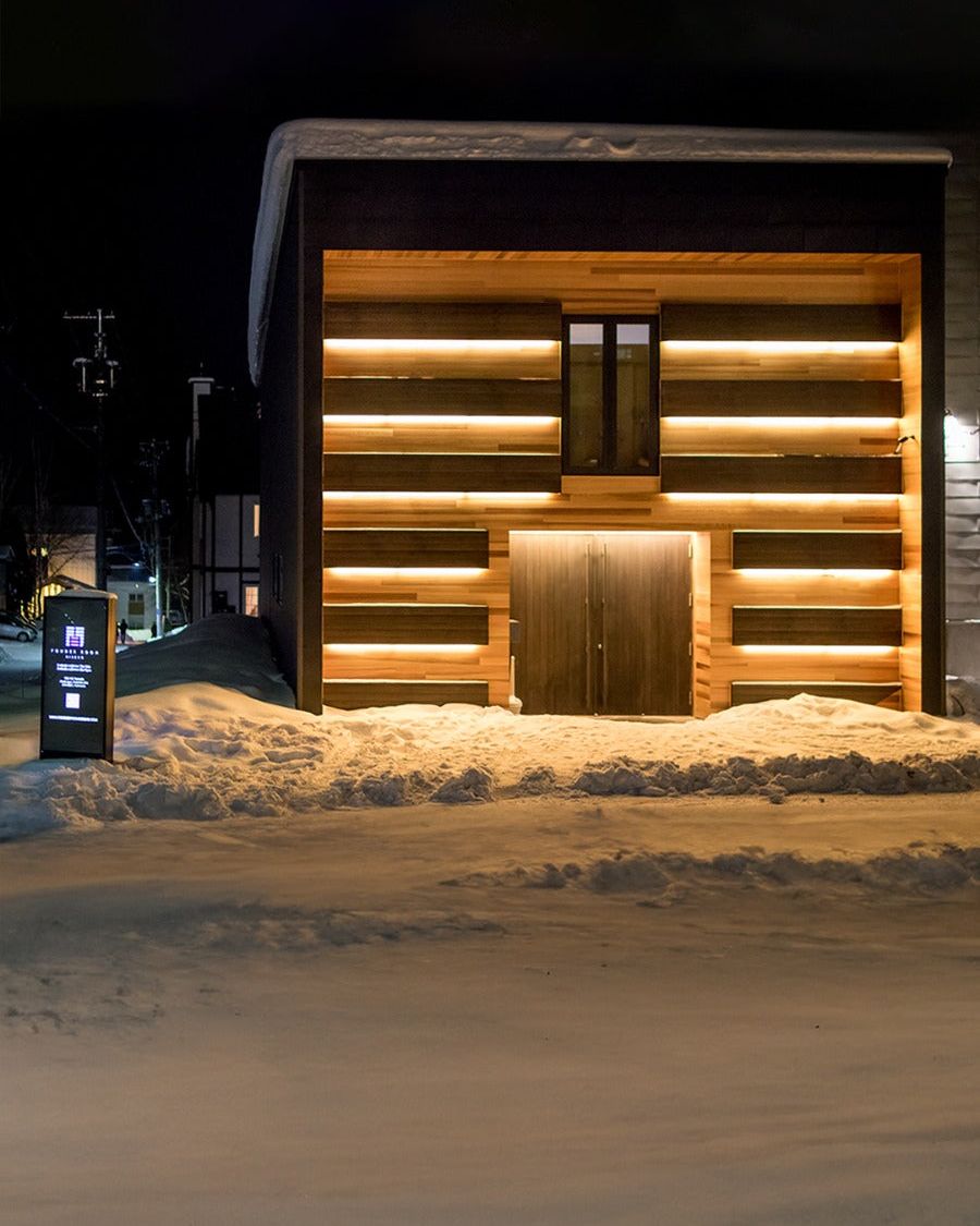 Powder Room Niseko from the street on a snowy night