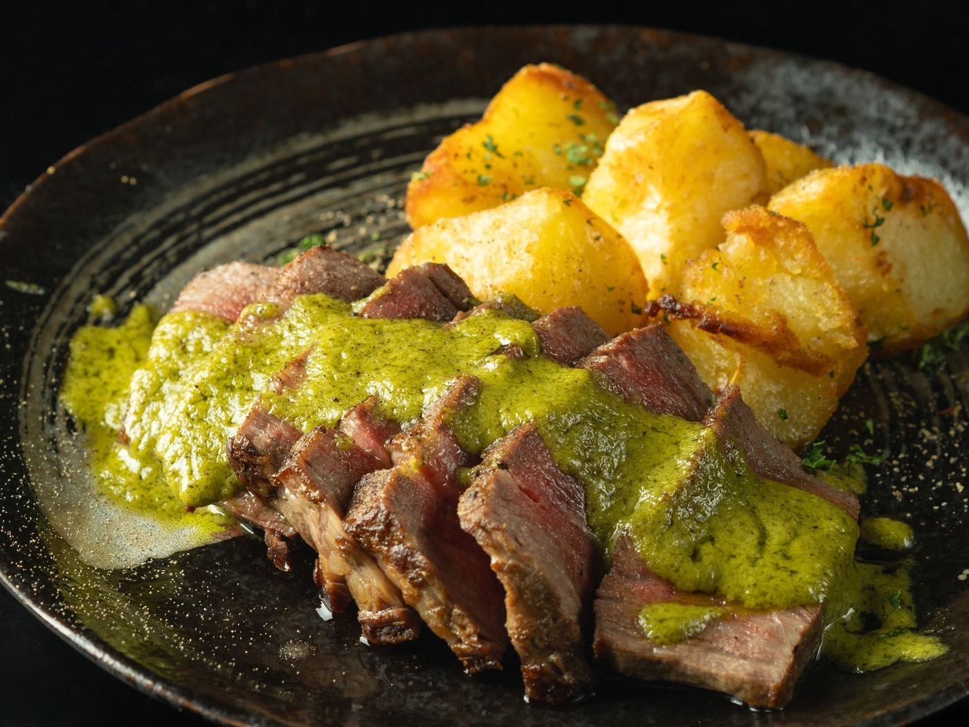 Kuro wagyu fillet with green sauce and roast potatoes
